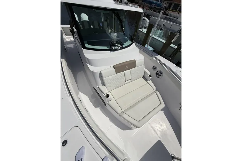  Yacht Photos Pics 2024 Bertram 39 CC boat with cushioned seating and sleek design.