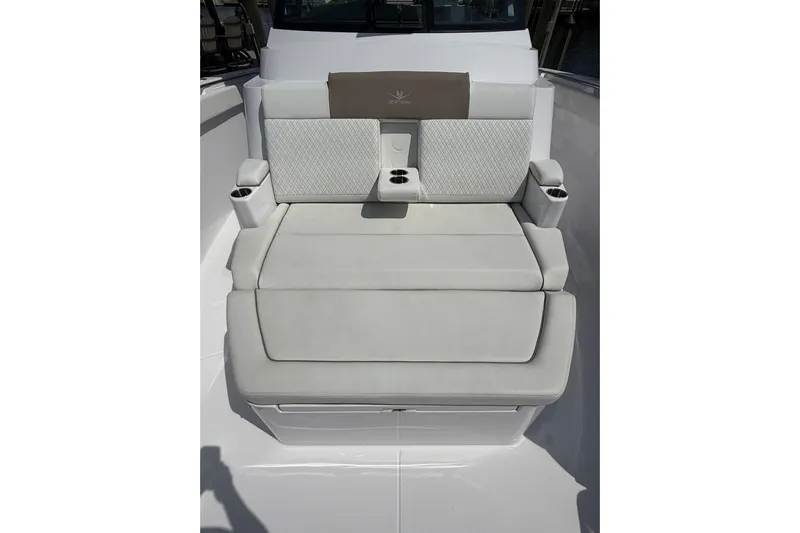  Yacht Photos Pics 2024 Bertram 39 CC boat seating area with cup holders and cushioned backrest.