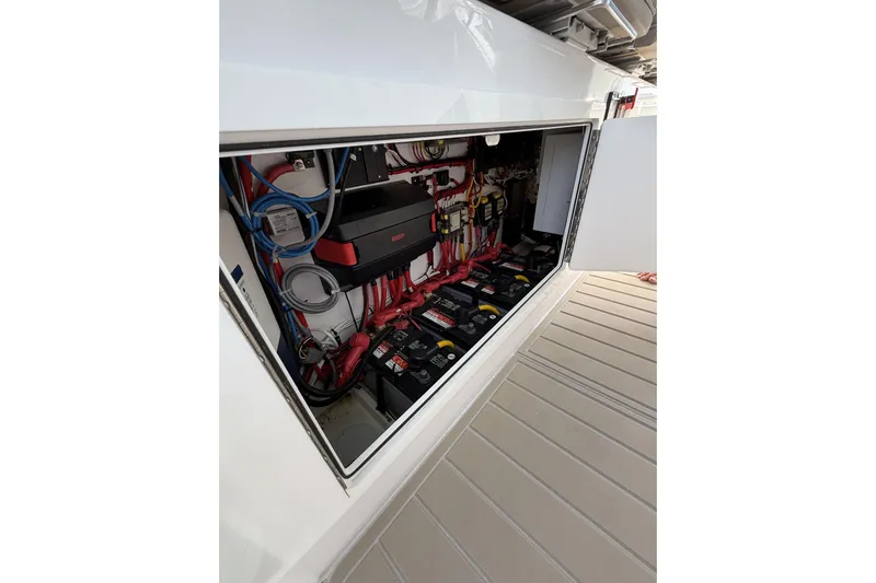  Yacht Photos Pics 2024 Bertram 39 CC electrical compartment with batteries and wiring.