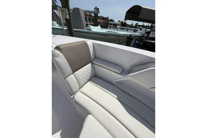  Yacht Photos Pics 2024 Bertram 39 CC boat interior with cushioned seating and elegant design.