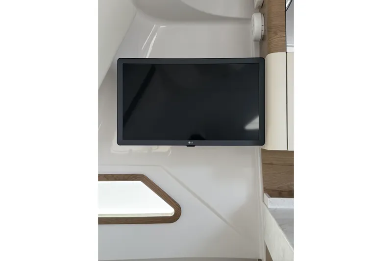  Yacht Photos Pics Flat-screen TV mounted in 2024 Bertram 39 CC boat interior.