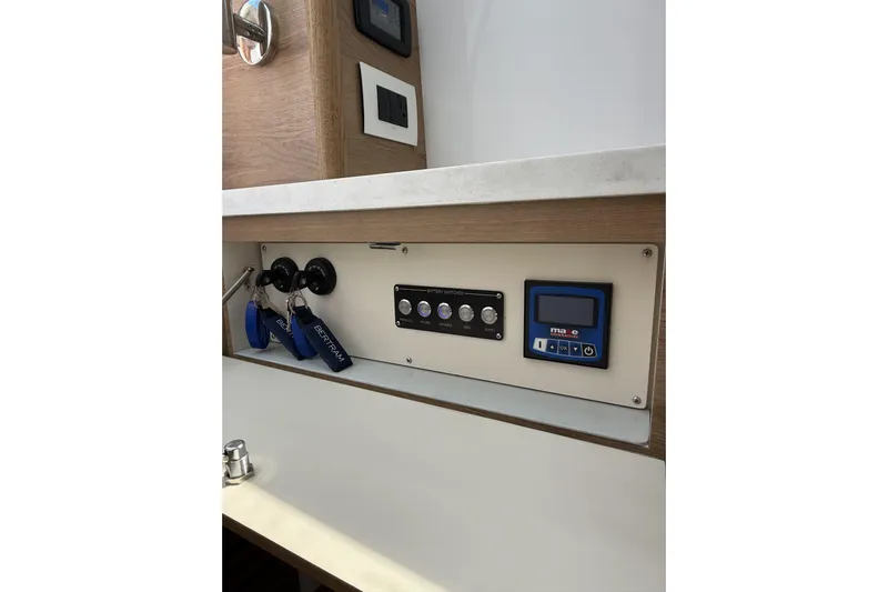  Yacht Photos Pics 2024 Bertram 39 CC control panel with keys and digital display.