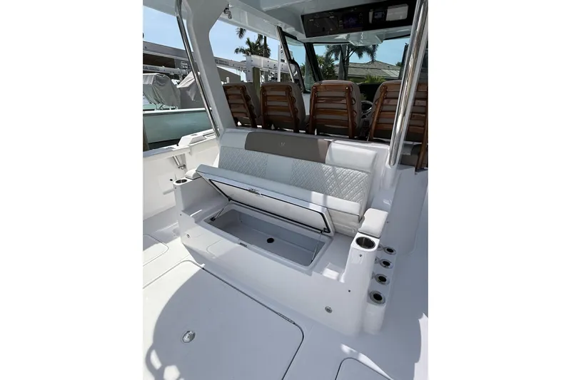  Yacht Photos Pics 2024 Bertram 39 CC boat interior with open storage compartment and seating.