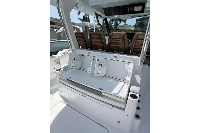  Yacht Photos Pics 2024 Bertram 39 CC boat interior with seating and storage compartments.