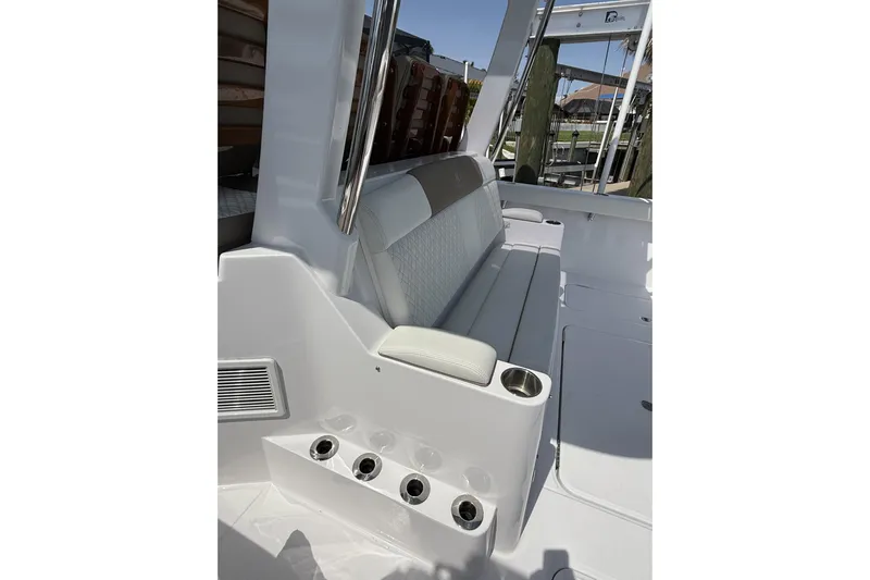  Yacht Photos Pics 2024 Bertram 39 CC boat interior with cushioned seating and cup holders.