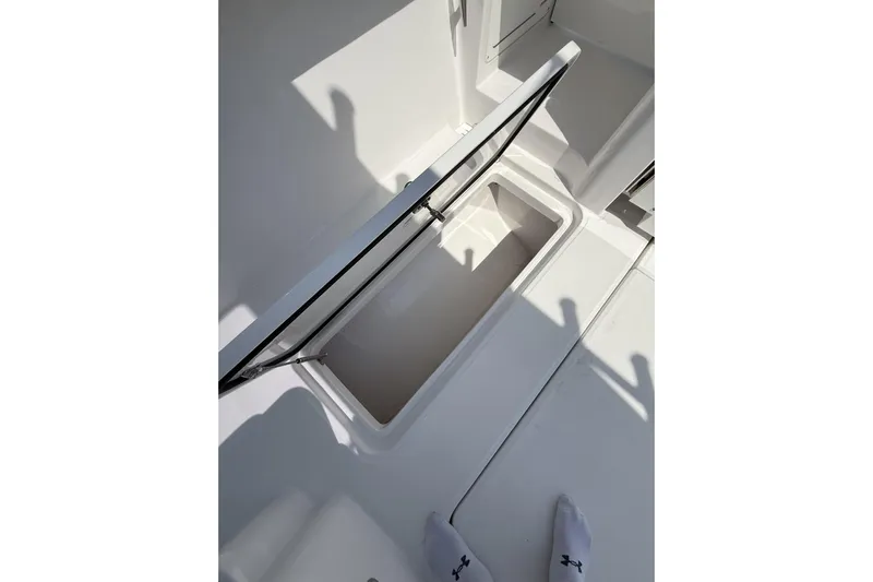  Yacht Photos Pics 2024 Bertram 39 CC boat storage compartment with open lid, showcasing interior space.