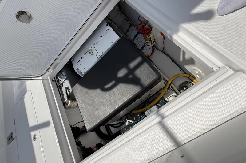  Yacht Photos Pics 2024 Bertram 39 CC boat engine compartment with wiring and components.