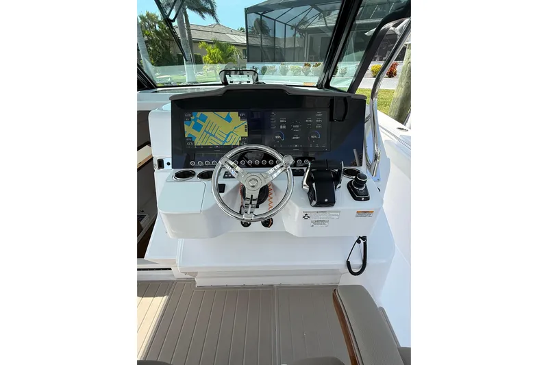  Yacht Photos Pics 2024 Bertram 39 CC boat helm with advanced navigation display and controls.