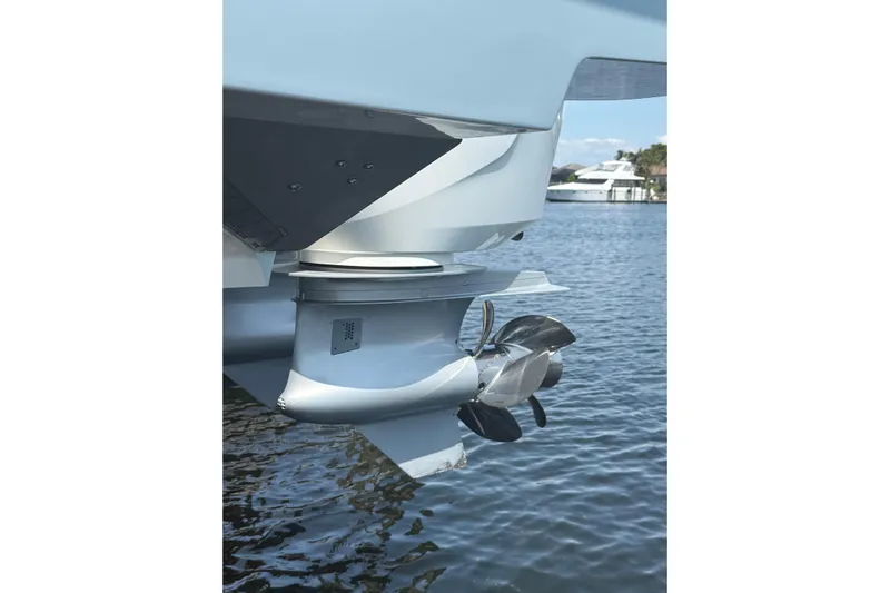  Yacht Photos Pics 2024 Bertram 39 CC boat propeller in water, showcasing sleek design and engineering.