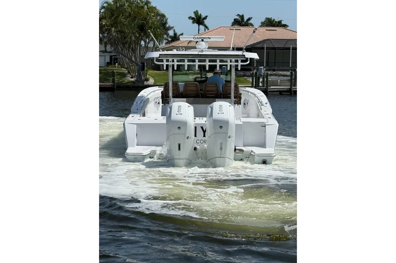  Yacht Photos Pics 2024 Bertram 39 CC boat cruising on a sunny day with twin engines.