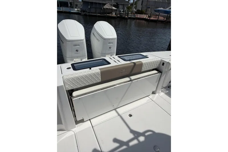  Yacht Photos Pics 2024 Bertram 39 CC boat with dual Mercury engines, featuring a cushioned seating area.