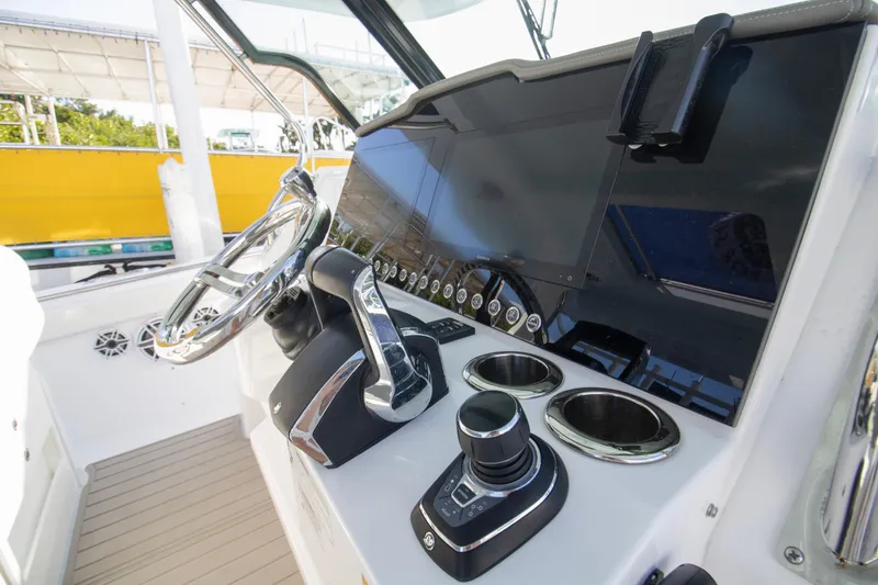  Yacht Photos Pics 2024 Bertram 39 CC boat helm with modern controls and steering wheel.