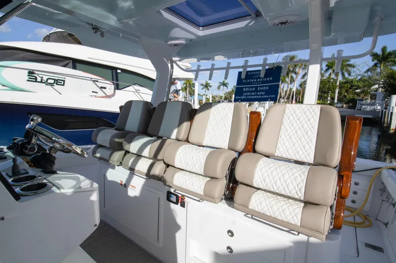  Yacht Photos Pics 2024 Bertram 39 CC boat interior with luxurious seating and modern design.