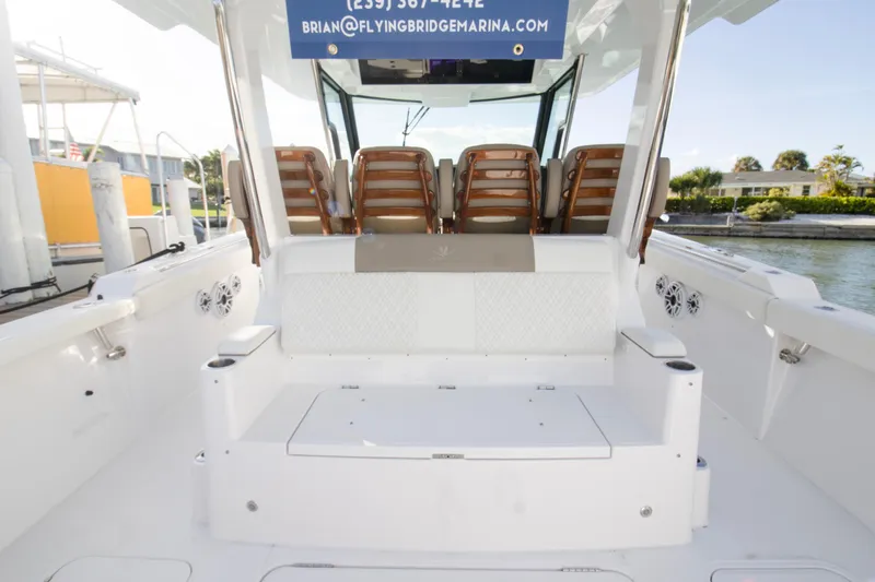  Yacht Photos Pics 2024 Bertram 39 CC boat interior with seating and water view.