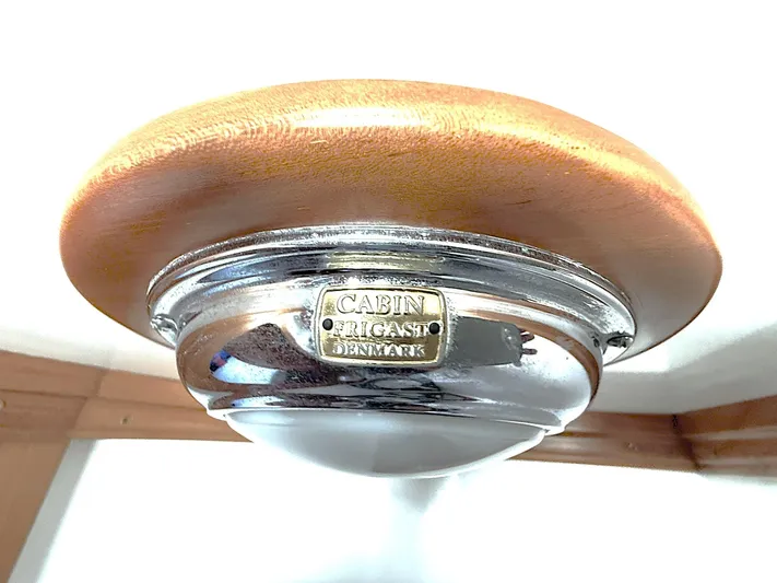 Sarah Yacht Photos Pics Ceiling light fixture in Cabo Rico Pearl Edition, 2000, with wooden and chrome design.