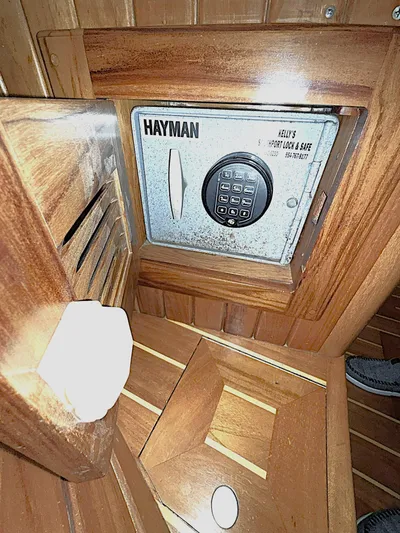 Sarah Yacht Photos Pics Secure safe inside Cabo Rico Pearl Edition Anniversary Special yacht, 2000 model, with wooden interior.