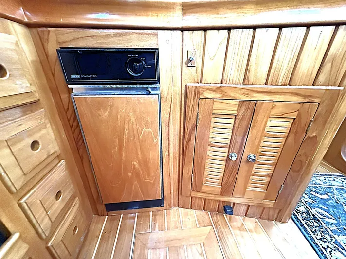 Sarah Yacht Photos Pics Wooden interior of 2000 Cabo Rico Pearl Edition yacht with built-in appliances.