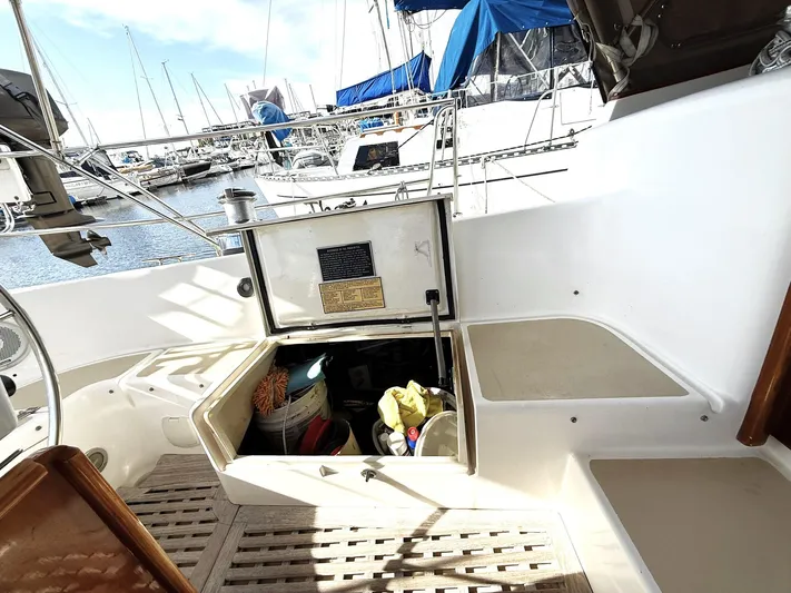 Sarah Yacht Photos Pics Cabo Rico Pearl Edition 2000 yacht cockpit with open storage, docked at marina.