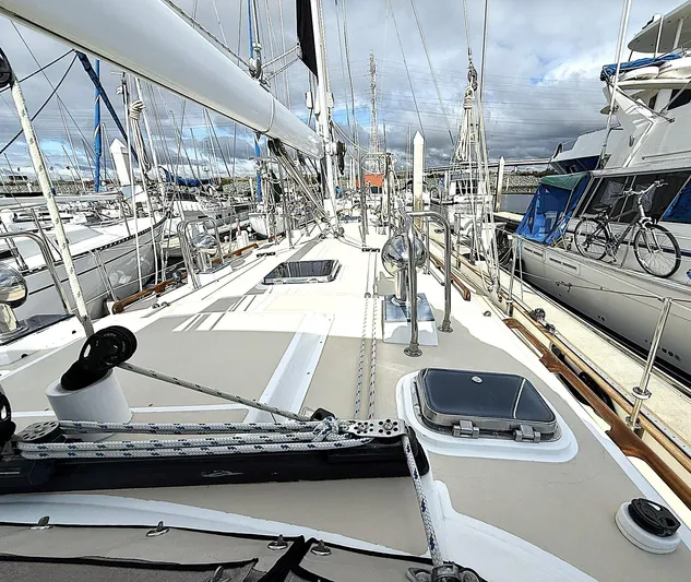 Sarah Yacht Photos Pics Sailboat deck view of 2000 Cabo Rico Pearl Edition Anniversary Special, docked in a marina.