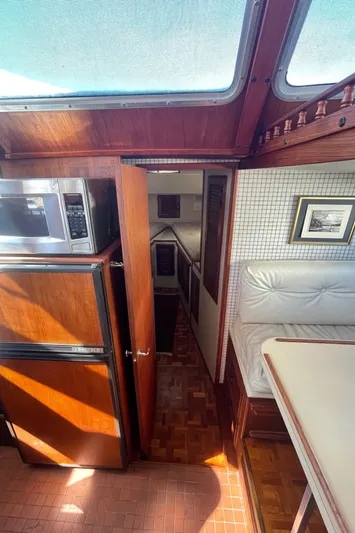  Yacht Photos Pics Interior of 1981 Tollycraft 48 Motor Yacht with wood finishes and natural light.