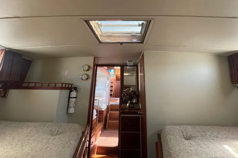  Yacht Photos Pics 1981 Tollycraft 48 Motor Yacht interior cabin with twin beds and skylight.
