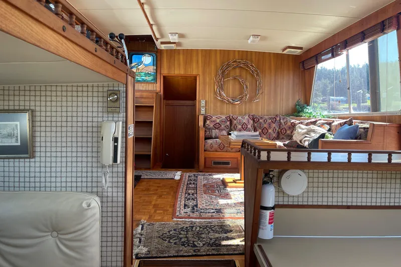  Yacht Photos Pics Interior of 1981 Tollycraft 48 Motor Yacht with cozy seating and wooden decor.