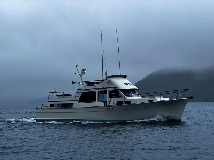  Yacht Photos Pics 1981 Tollycraft 48 Motor Yacht cruising on a misty, overcast day.
