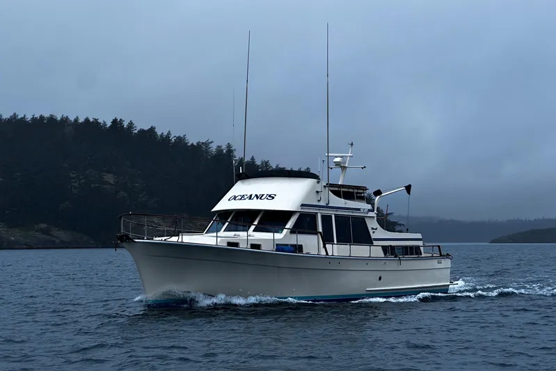  Yacht Photos Pics 1981 Tollycraft 48 Motor Yacht cruising on a misty lake.