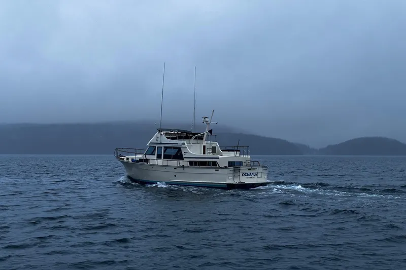  Yacht Photos Pics 1981 Tollycraft 48 Motor Yacht cruising on a misty lake.