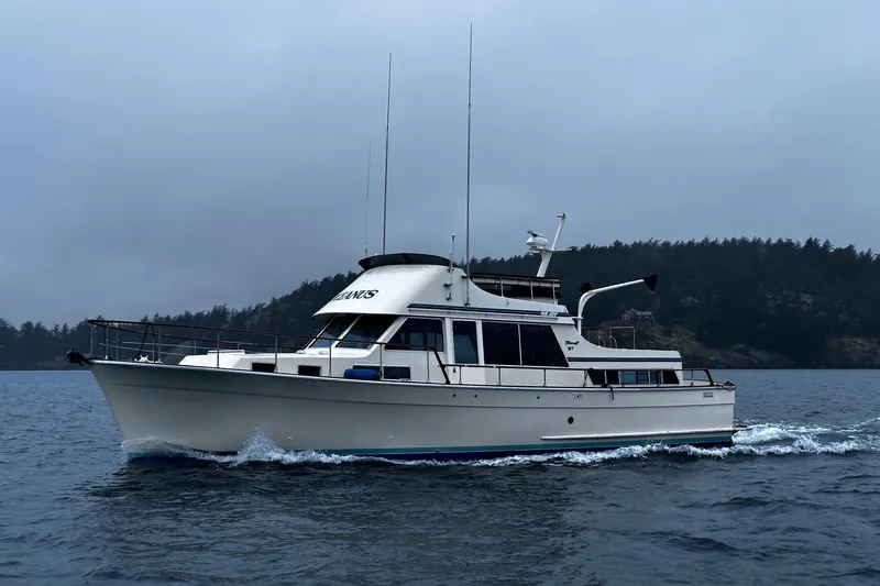  Yacht Photos Pics 1981 Tollycraft 48 Motor Yacht cruising on a cloudy day.