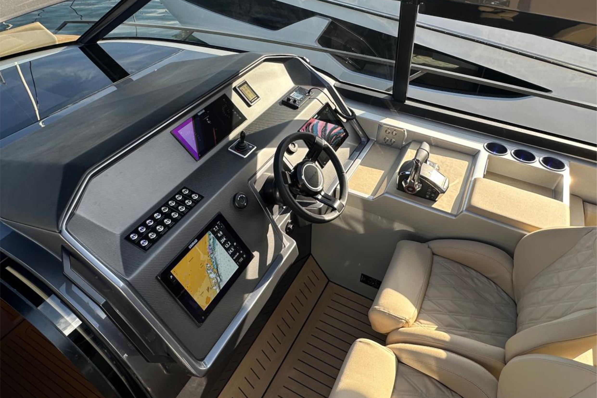 Luxurious 2025 Focus 3X yacht cockpit with advanced navigation and plush seating.