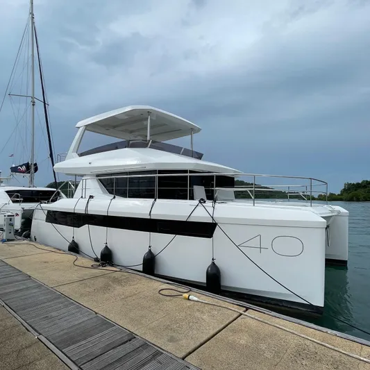 Leopard 40pc Yacht Photos Pics 2025 Leopard 40PC yacht docked at marina under cloudy sky.