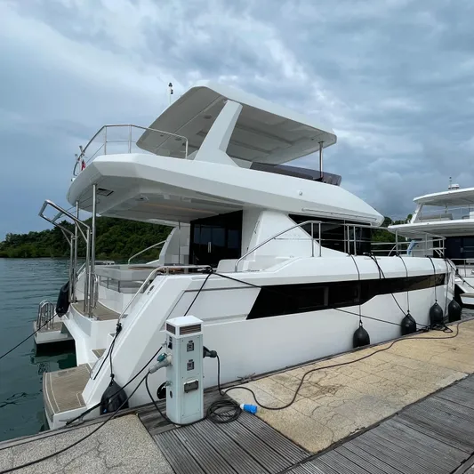 Leopard 40pc Yacht Photos Pics 2025 Leopard 40PC yacht docked at marina under cloudy sky.