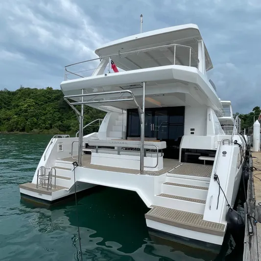 Leopard 40pc Yacht Photos Pics 2025 Leopard 40PC yacht docked, showcasing sleek design and spacious deck under cloudy skies.