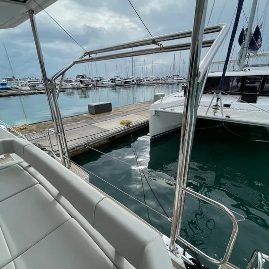 Leopard 40pc Yacht Photos Pics 2025 Leopard 40PC yacht docked at marina, showcasing sleek design and spacious seating.