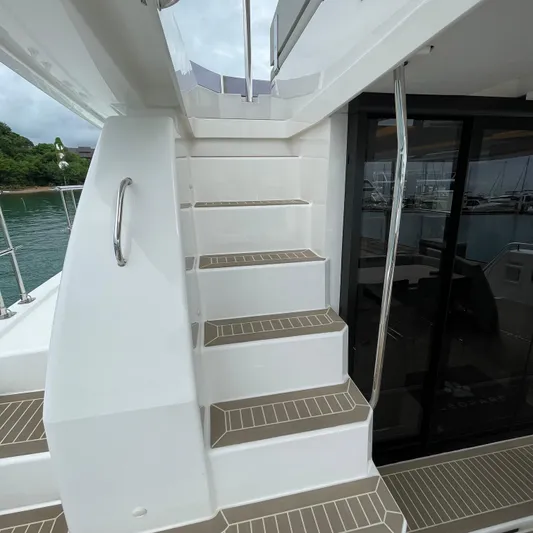Leopard 40pc Yacht Photos Pics Staircase on 2025 Leopard 40PC yacht, leading to upper deck with sleek design.