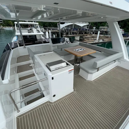 Leopard 40pc Yacht Photos Pics Luxurious 2025 Leopard 40PC yacht deck with seating and dining area.