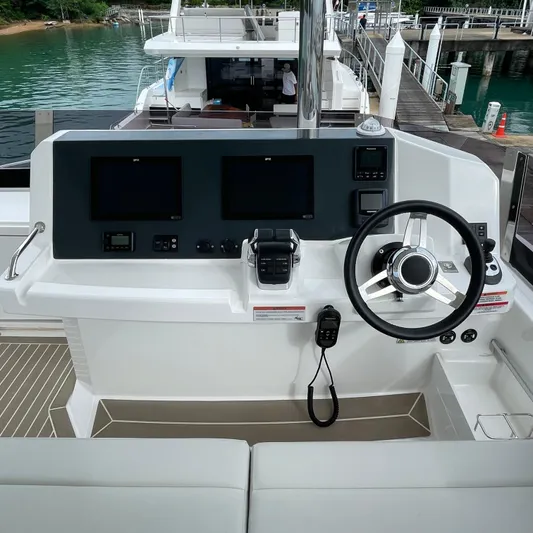 Leopard 40pc Yacht Photos Pics Helm of 2025 Leopard 40PC yacht with modern controls and steering wheel.