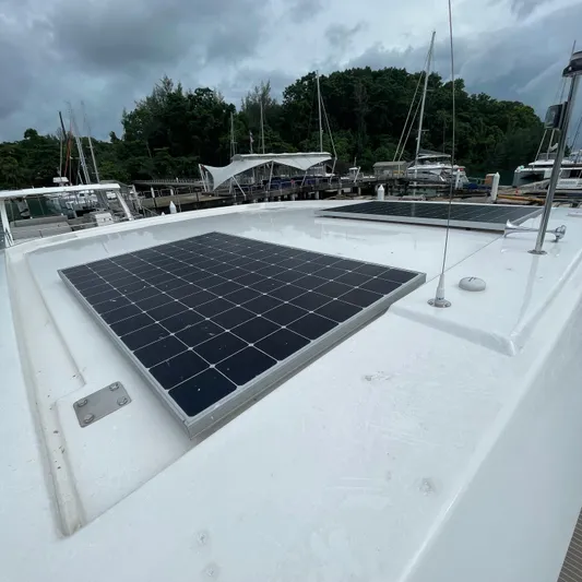 Leopard 40pc Yacht Photos Pics 2025 Leopard 40PC yacht with solar panels on deck, docked at marina.