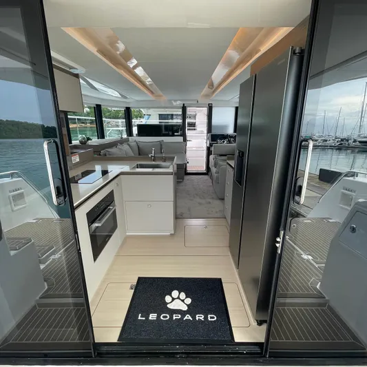 Leopard 40pc Yacht Photos Pics Interior view of 2025 Leopard 40PC yacht, featuring modern kitchen and luxurious seating area.