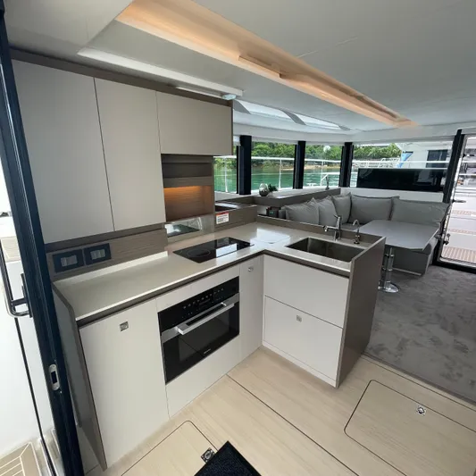 Leopard 40pc Yacht Photos Pics Modern kitchen and lounge area inside a 2025 Leopard 40PC yacht.