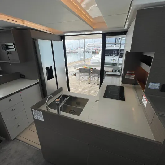 Leopard 40pc Yacht Photos Pics Modern kitchen interior of 2025 Leopard 40PC yacht with sleek design and marina view.
