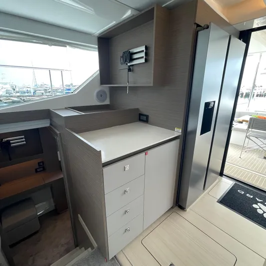 Leopard 40pc Yacht Photos Pics Modern interior of 2025 Leopard 40PC yacht with sleek cabinetry and stainless steel appliances.