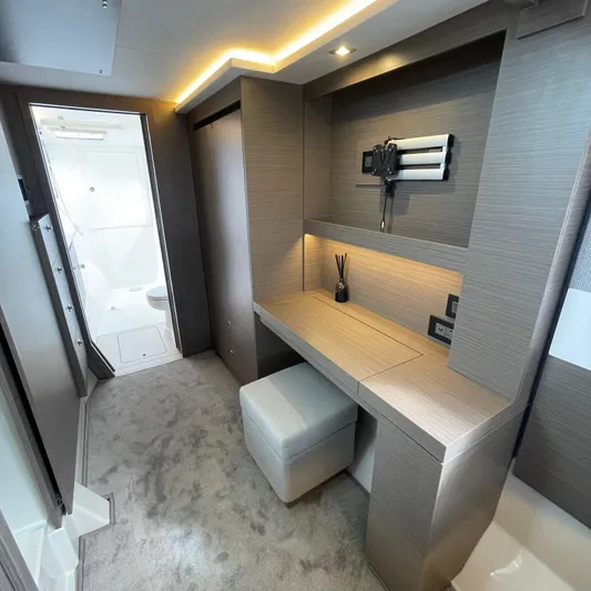 Leopard 40pc Yacht Photos Pics Modern interior of 2025 Leopard 40PC yacht with sleek desk and ambient lighting.