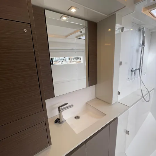 Leopard 40pc Yacht Photos Pics Modern bathroom interior of 2025 Leopard 40PC yacht with sleek sink and shower.