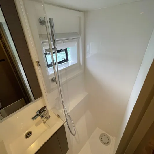 Leopard 40pc Yacht Photos Pics Modern bathroom in 2025 Leopard 40PC yacht with sleek shower and window.