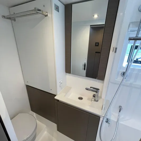 Leopard 40pc Yacht Photos Pics Modern bathroom in 2025 Leopard 40PC yacht with sleek fixtures and mirror.