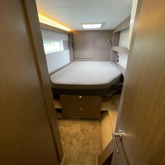 Leopard 40pc Yacht Photos Pics 2025 Leopard 40PC cabin interior with bed, modern design, and soft lighting.