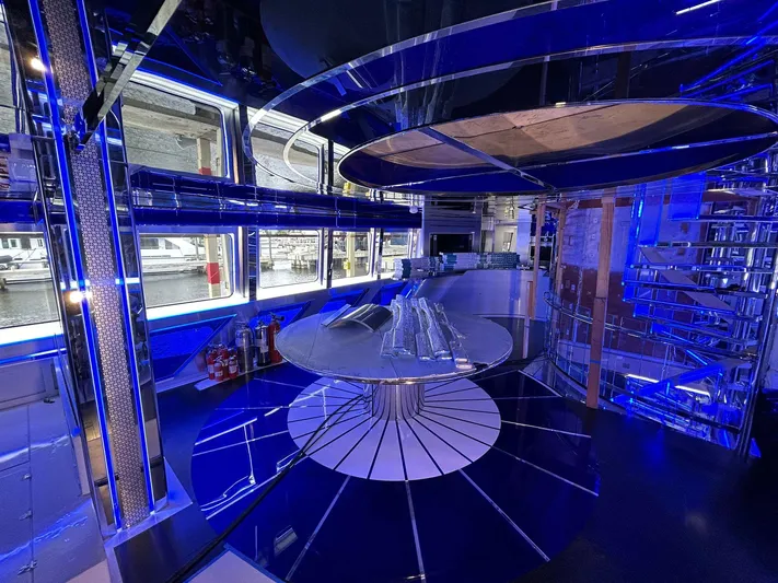 1992/2016 Heesen Motor Yacht Yacht Photos Pics Luxurious interior of 1992 Heesen 141 Motor Yacht with modern blue lighting and sleek design.