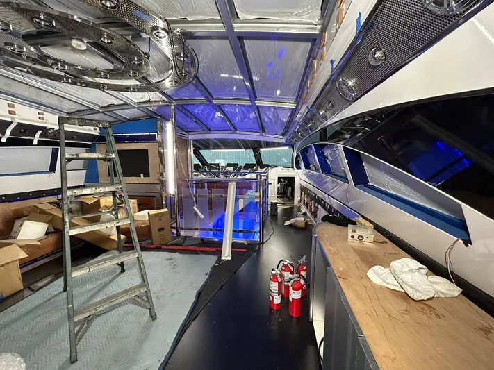 1992/2016 Heesen Motor Yacht Yacht Photos Pics Interior of 1992 Heesen 141 Motor Yacht under renovation, featuring tools and fire extinguishers.